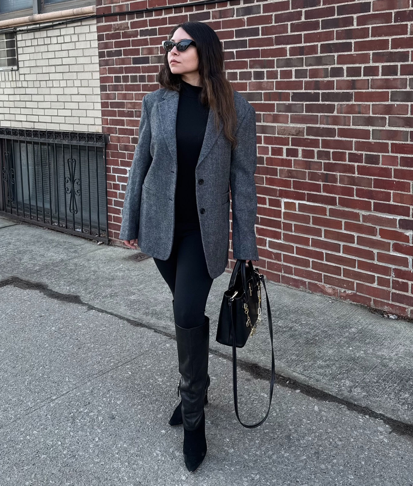 How to wear leggings in 2026: original photo of PureWow editor Stephanie Maida in gray oversized blazer and leggings