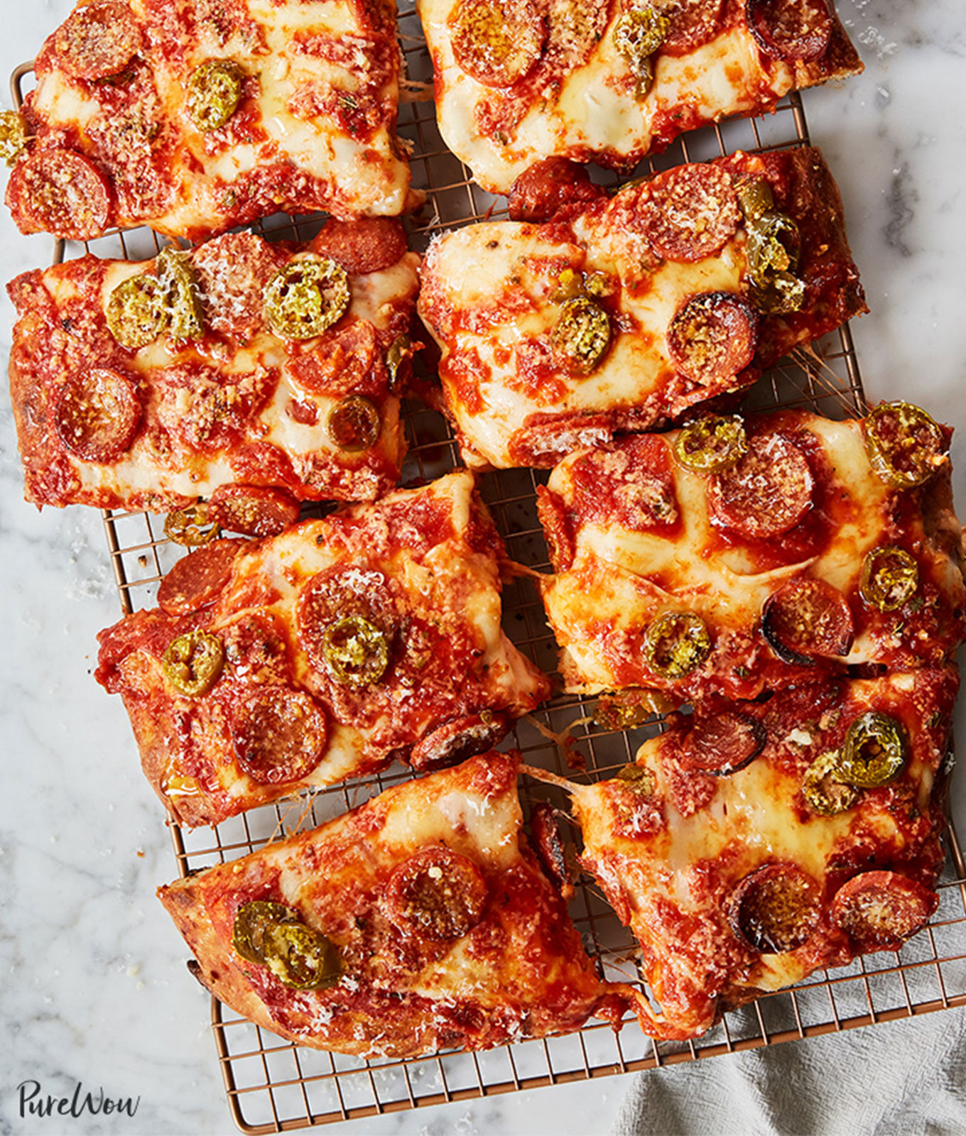 jalapeño recipes: sicilian pizza with pepperoni and jalapenos, sliced into squares