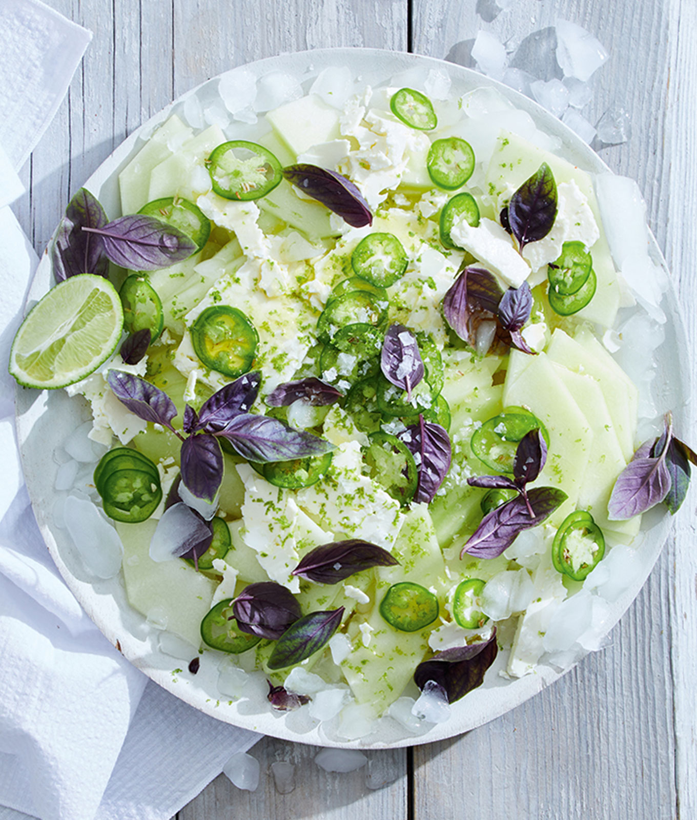 jalapeño recipes: plate with honeydew, jalapeno, feta cheese and flowers