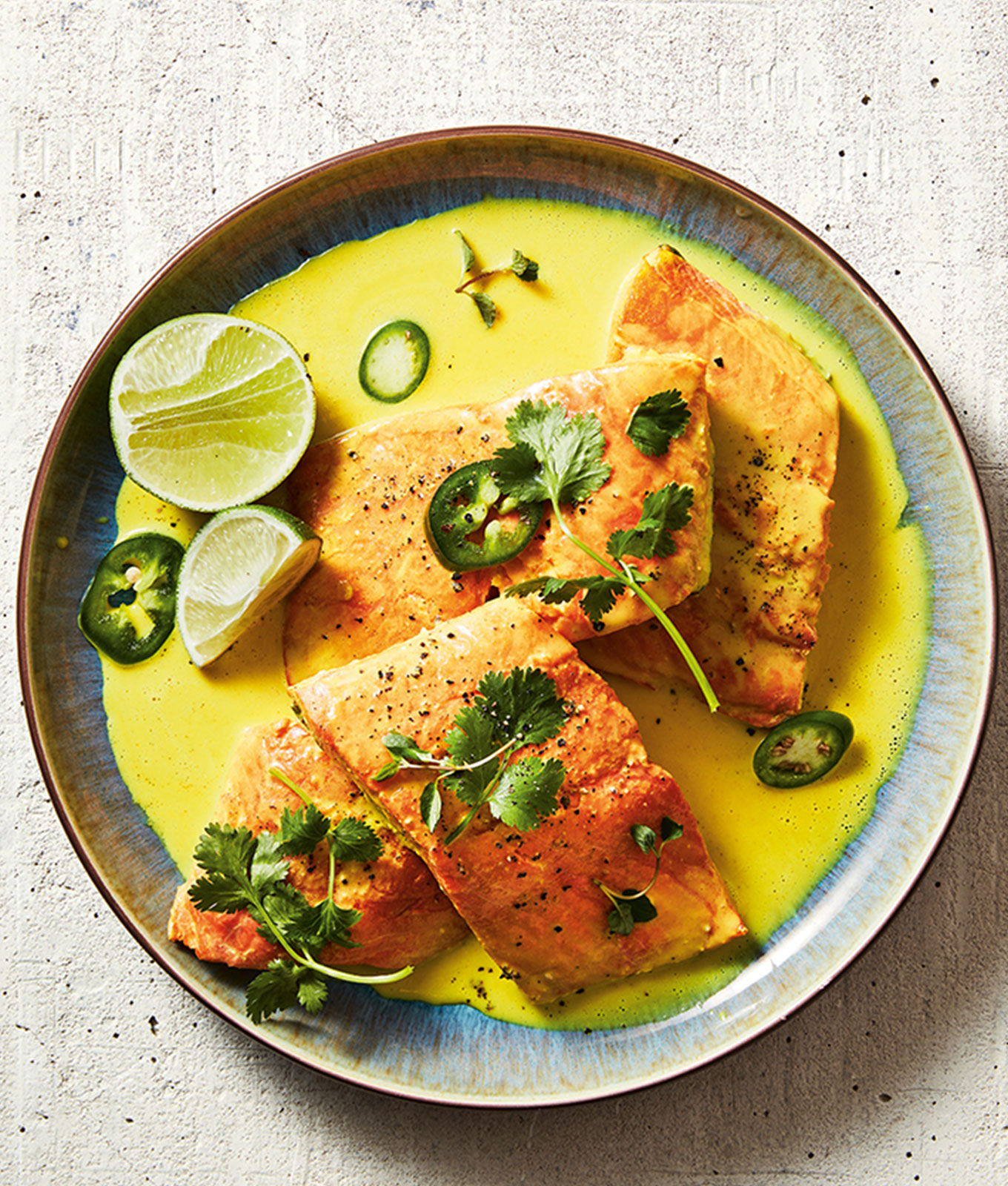 jalapeño recipes: jalapeno-topped salmon in a pool of turmeric coconut broth