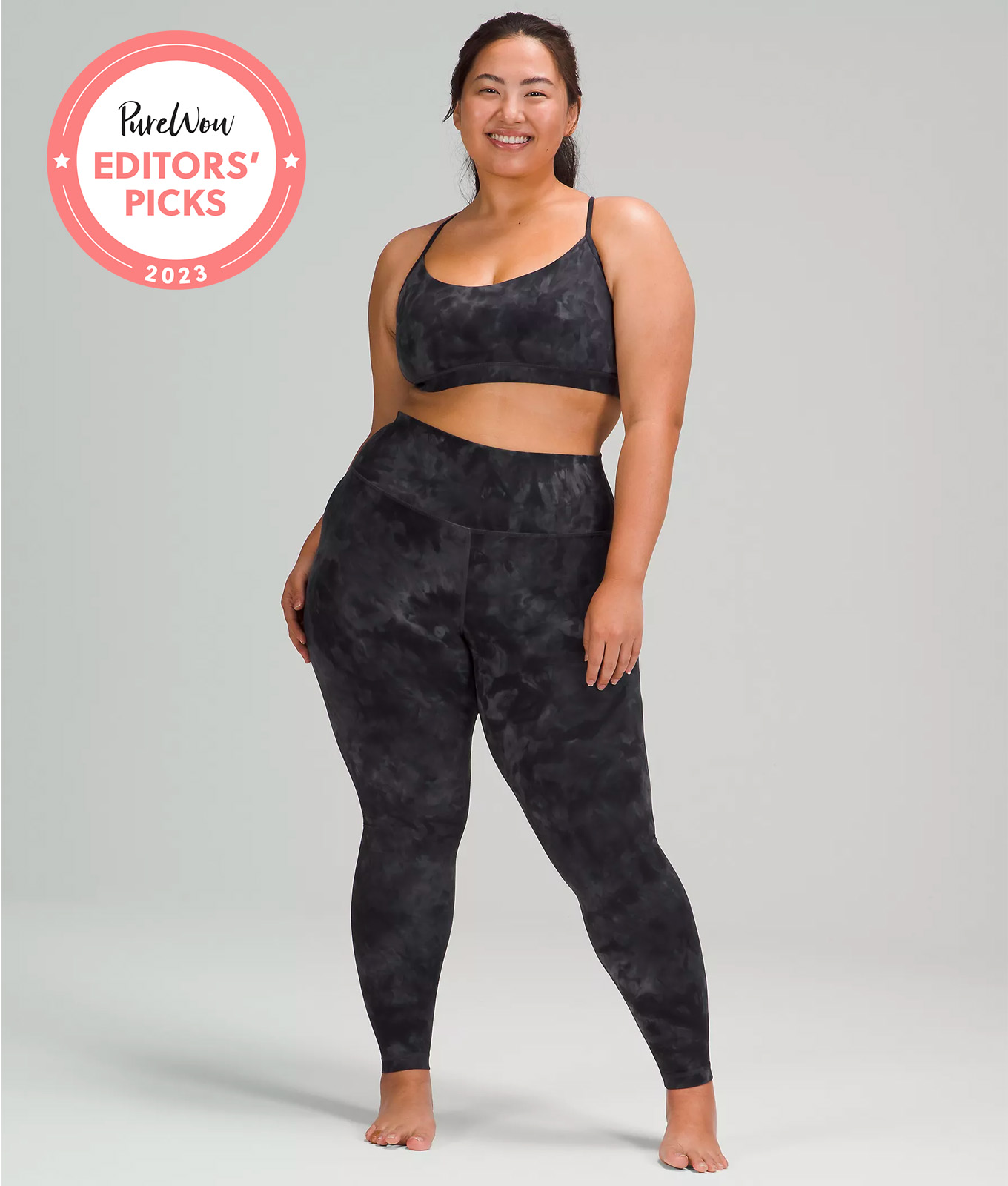 Lululemon model in high wasted Align black camo leggings and bra.