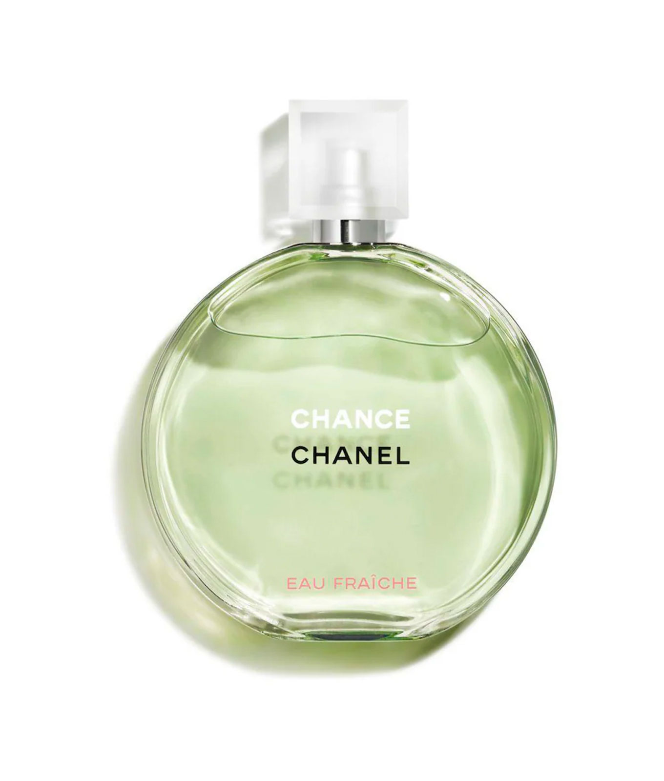 best-bedtime-perfume: A round and flat perfume bottle with green liquid inside.