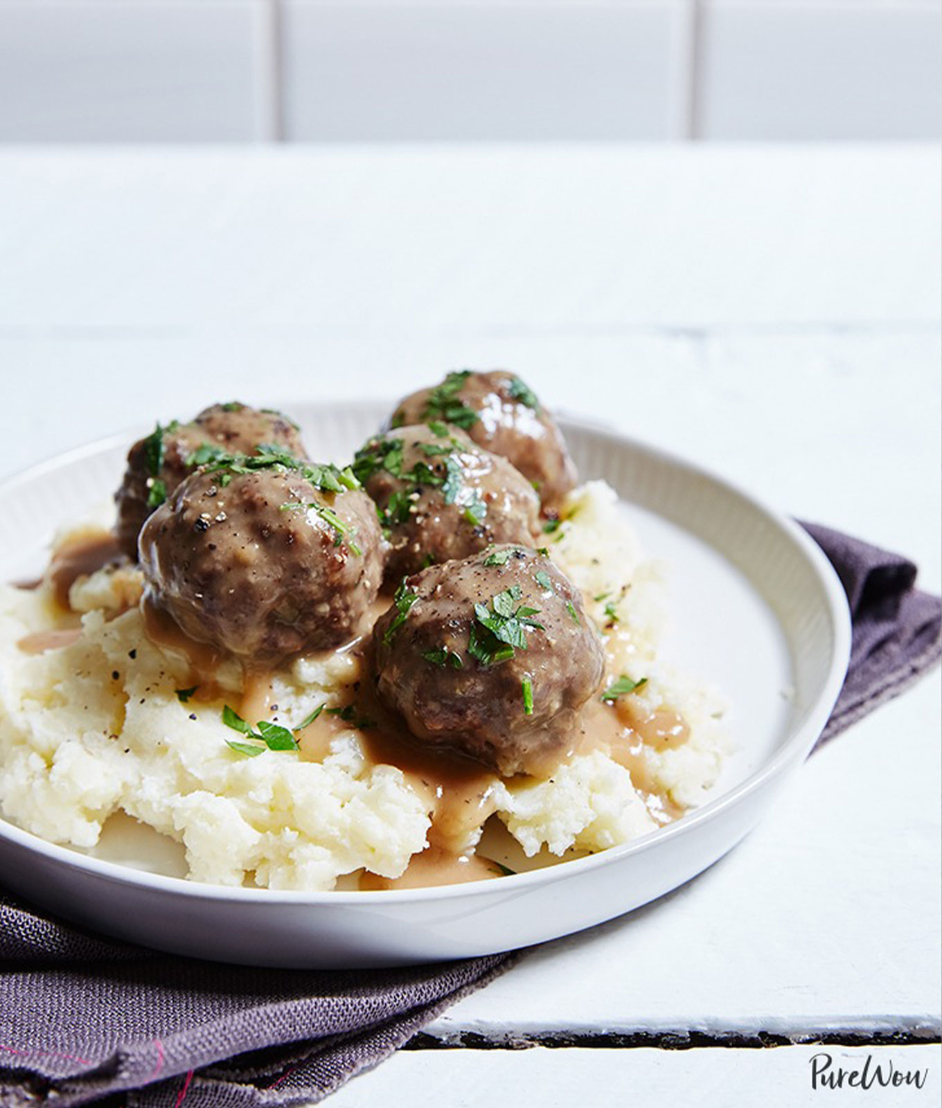 a plate of swedish meatballs and mashed potatoes