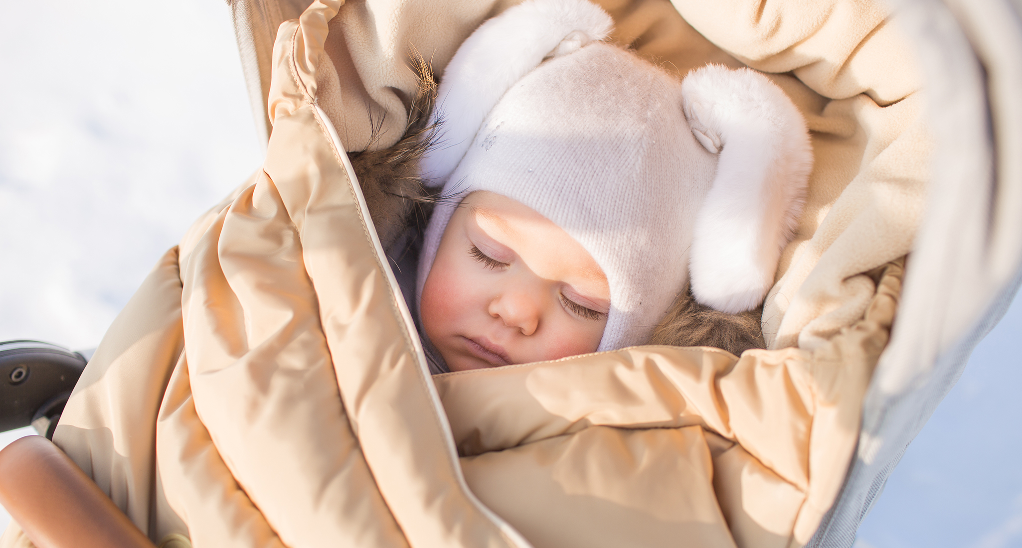 Scandinavian-looking-baby-asleep-outside-in-the-snow