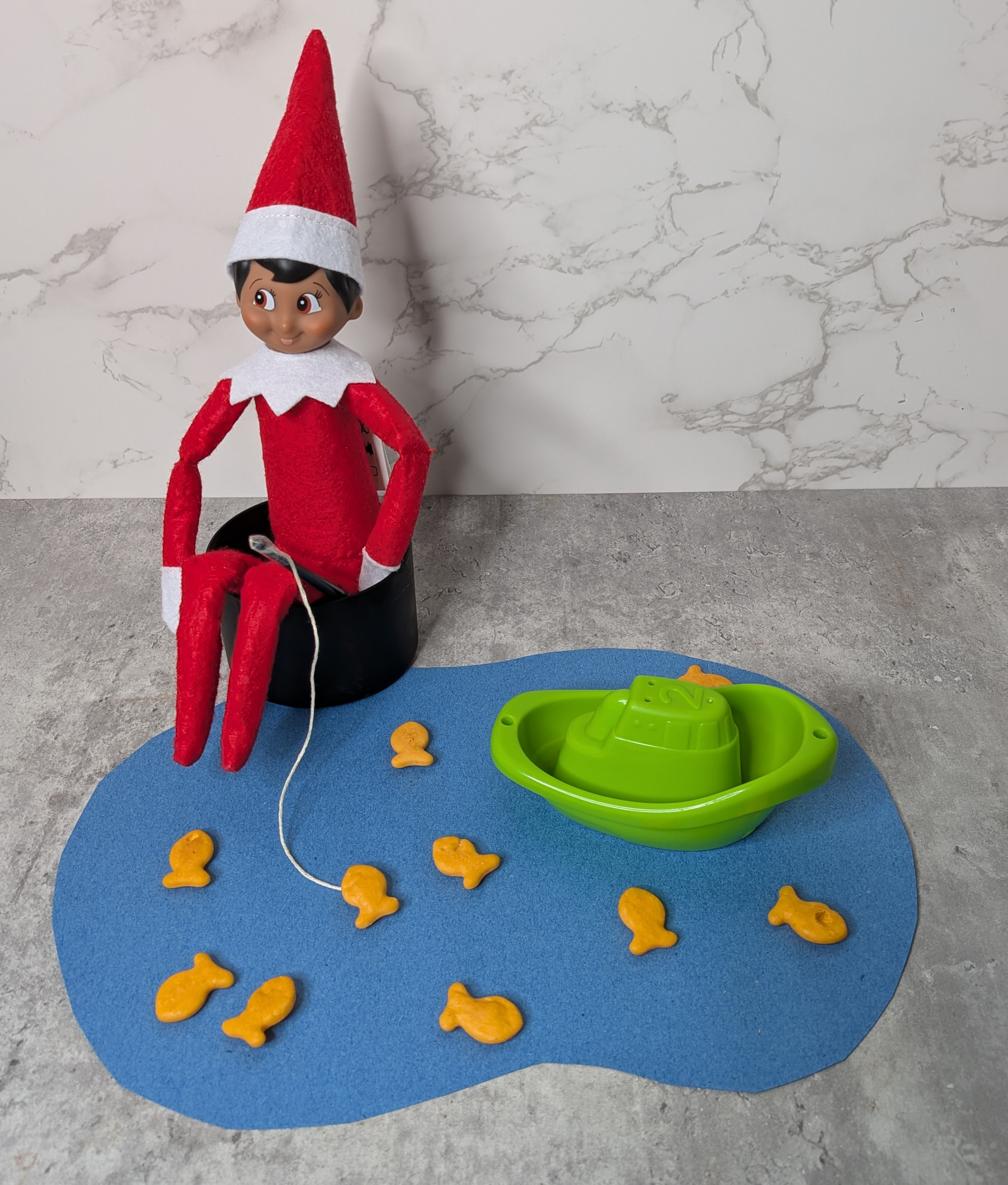 elf with fake pond goldfishing