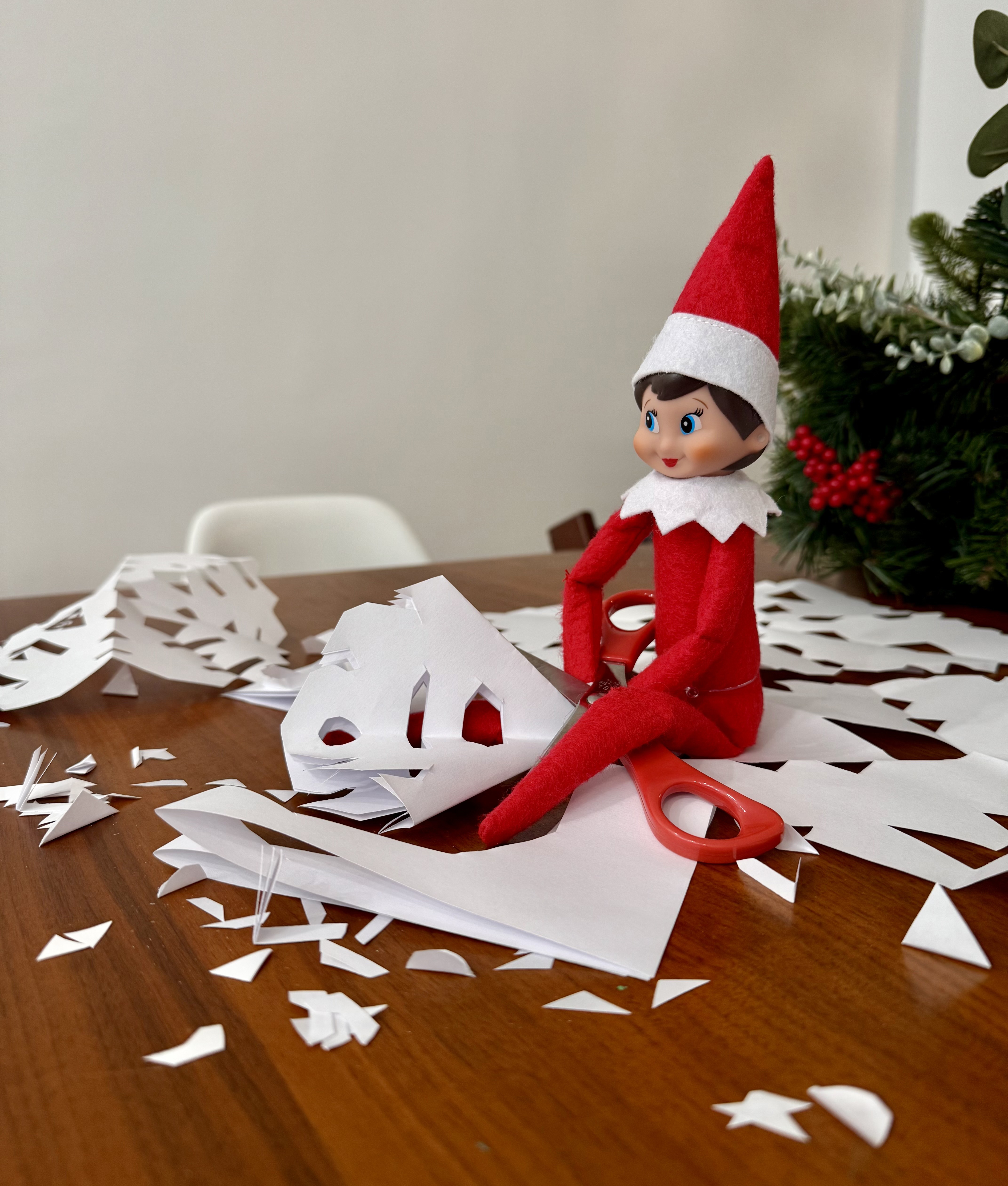 elf making snowflakes