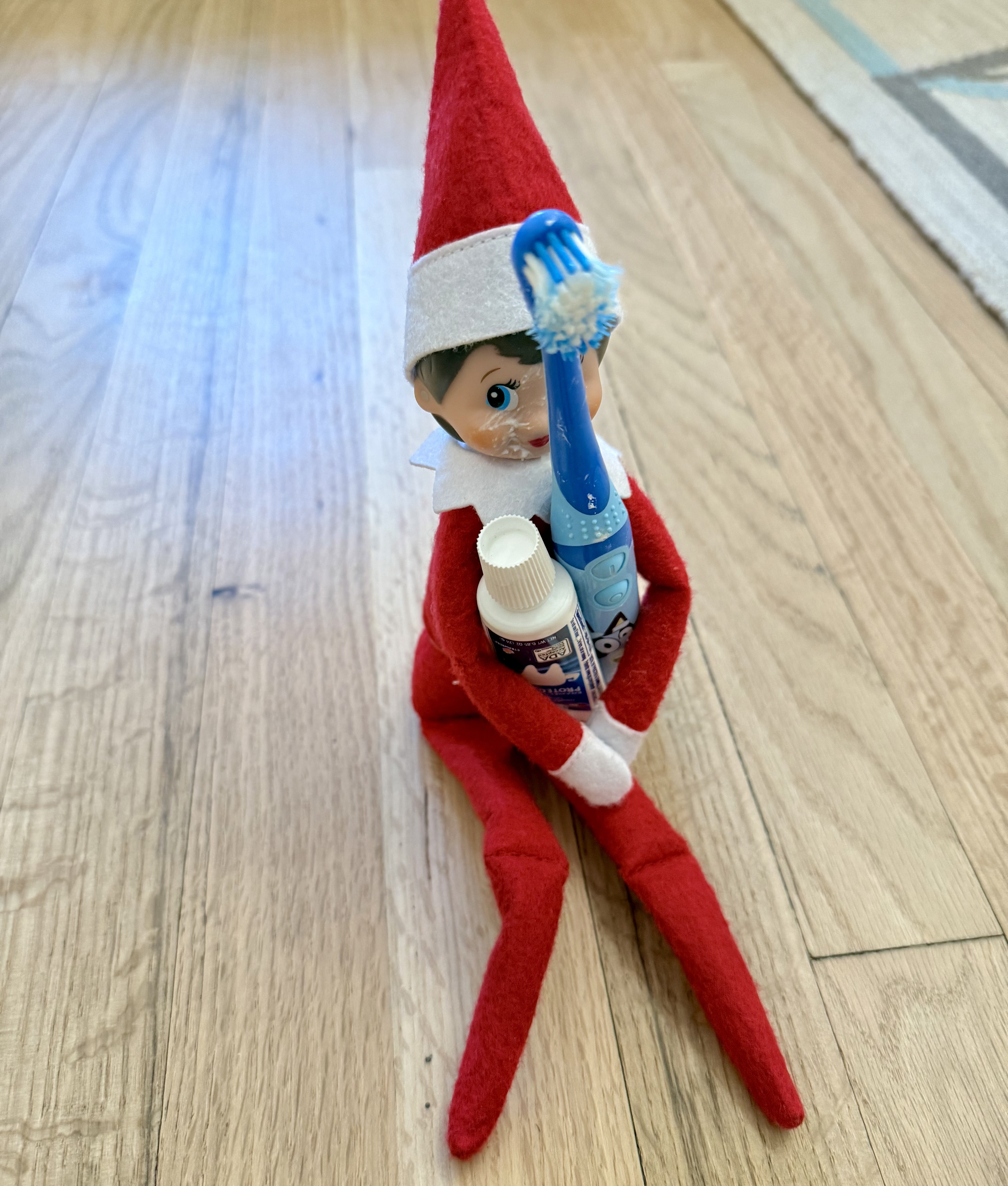 elf with toothbrush