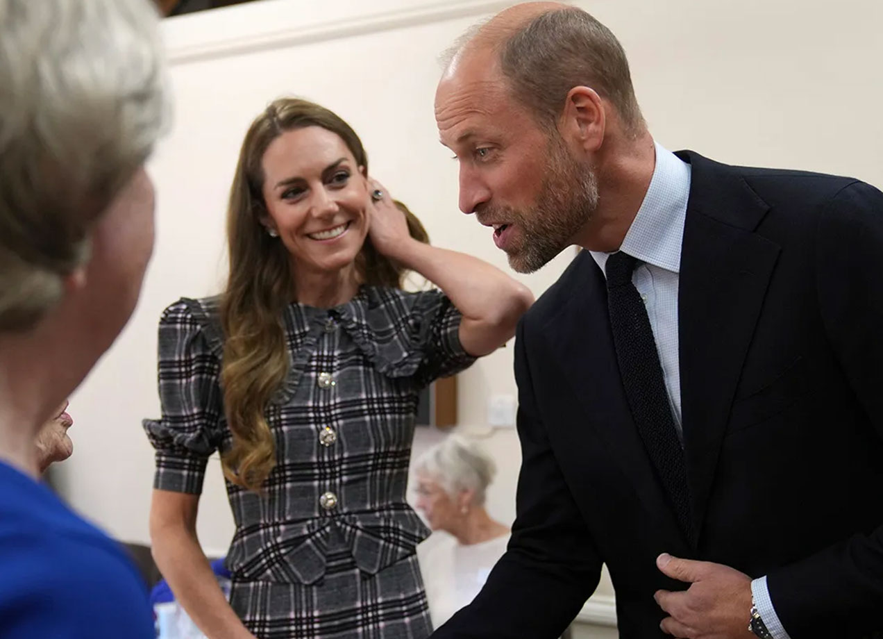 kate middleton hair move: kate middleton tucking her hair behind her ear alongside prince william