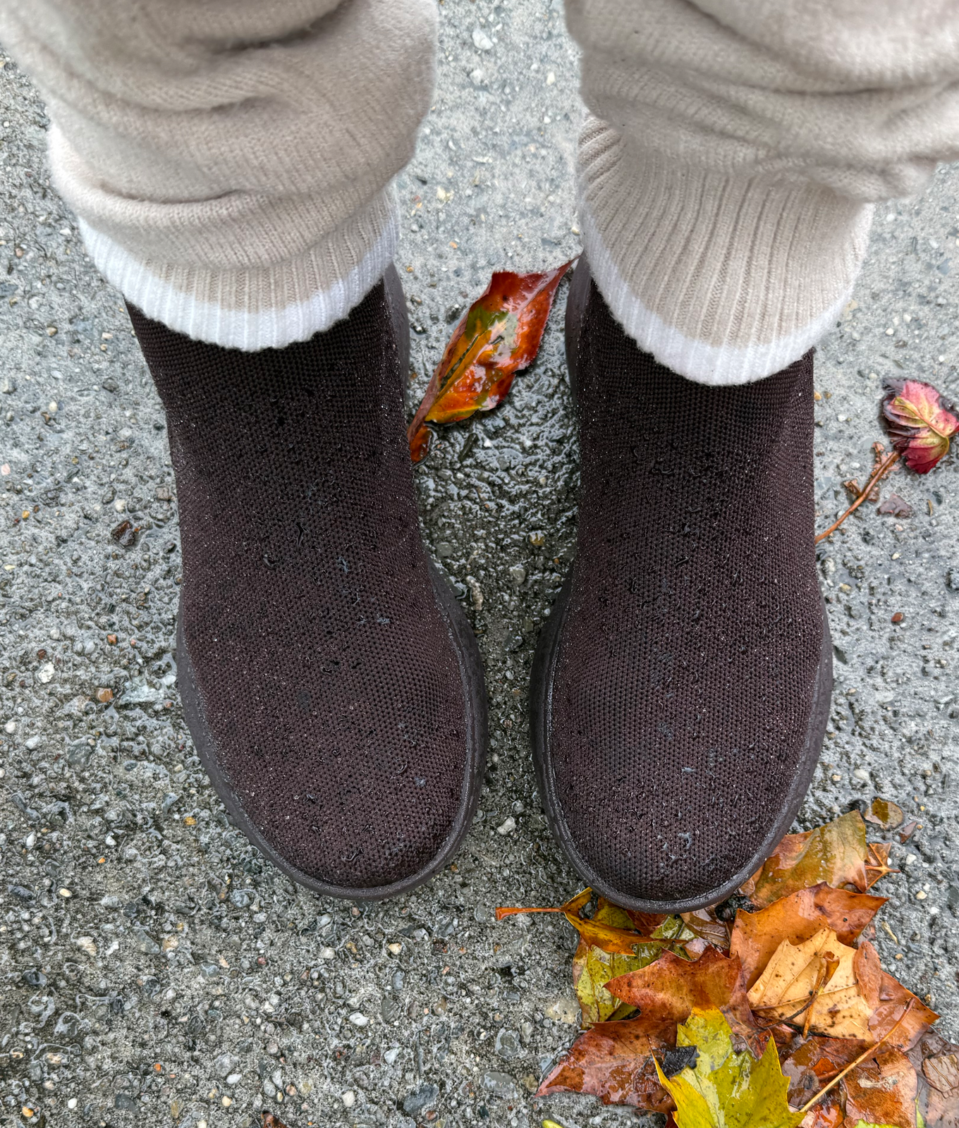Vivaia Sneaker Boots Review: Original photo of brown Vivaia Sneaker Boots on editor Stephanie Maida with wet leaves