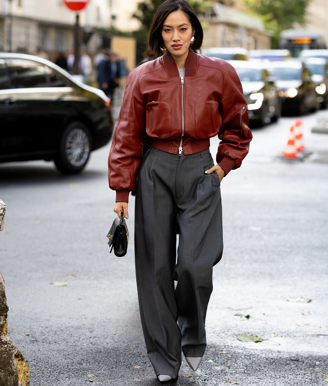 woman wearing a leather bomber jacket with trousers