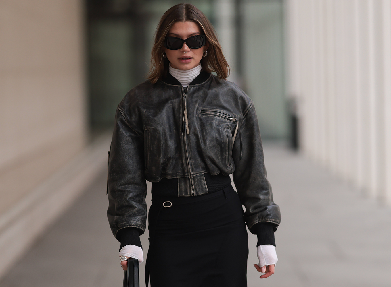 woman wearing a leather bomber jacket