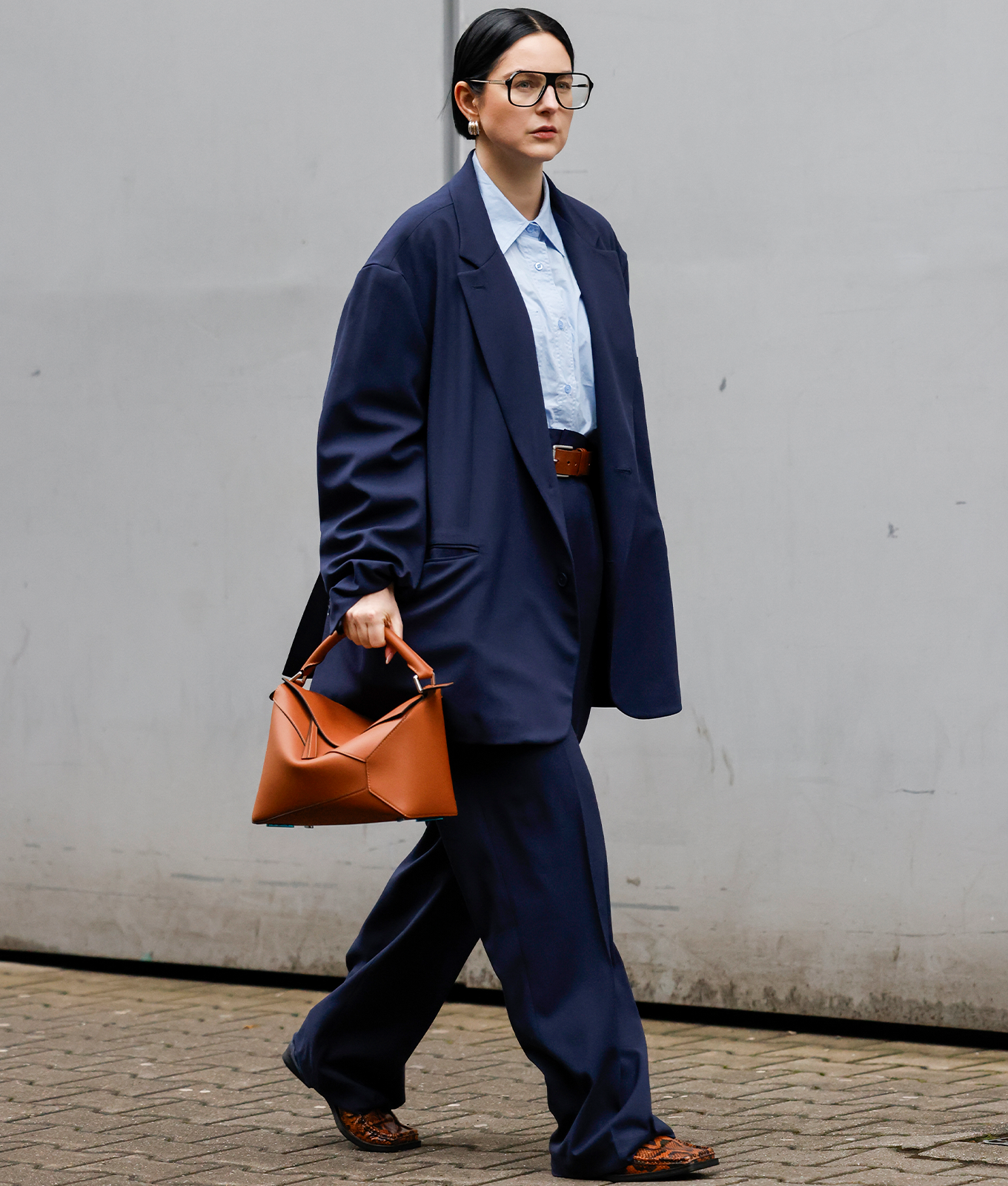 woman wearing a navy suit winter color trends 2026