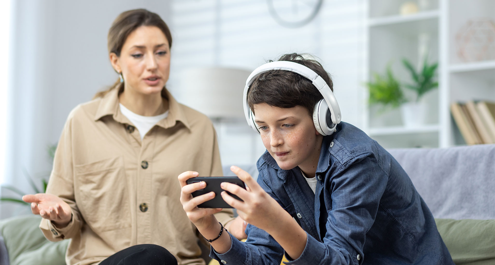 npc-tween-slang: a mom watching their son play video games
