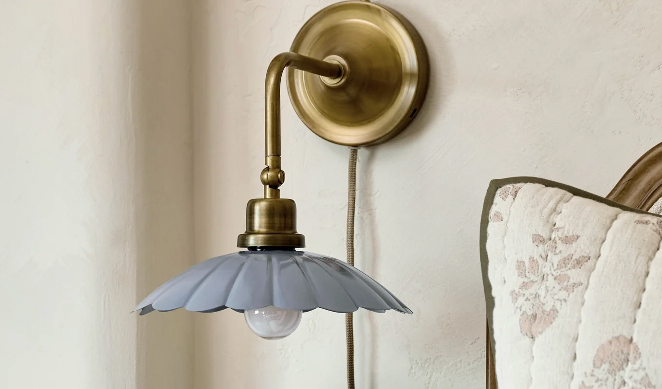 Magnolia brass and enamel plug-in sconce