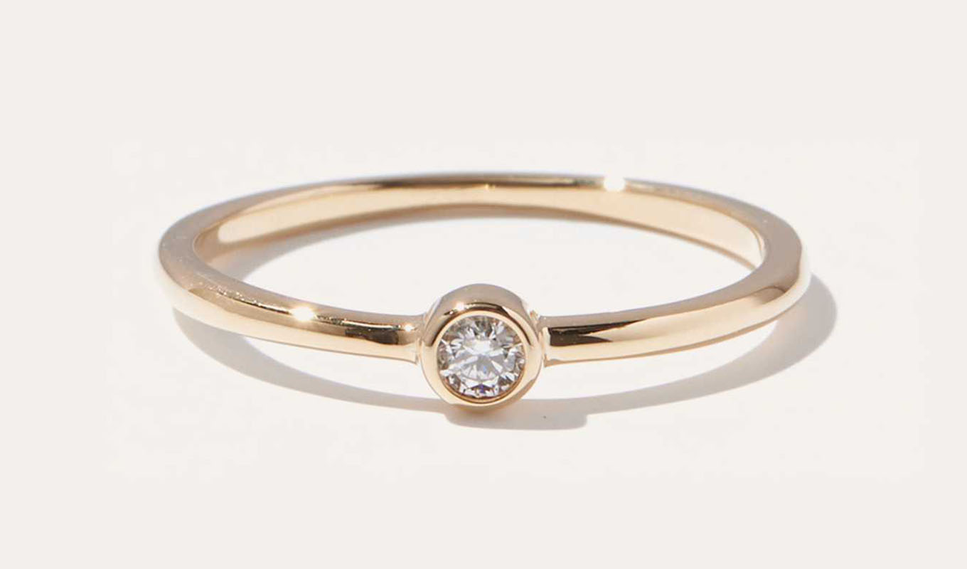 The Quince 14K Gold Solo Diamond Bezel Ring.