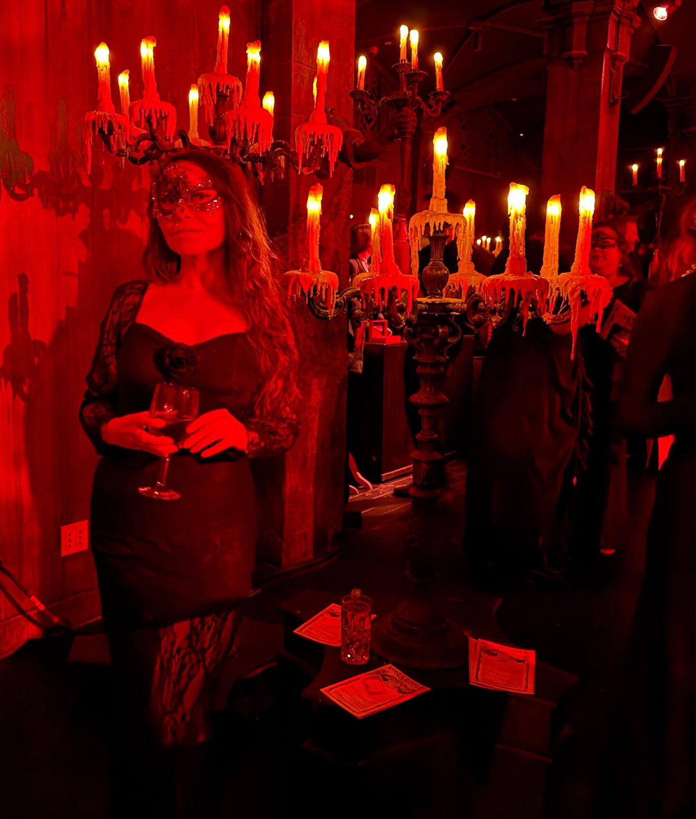 'Masquerade' Review: Stephanie Maida in red light with candelabra