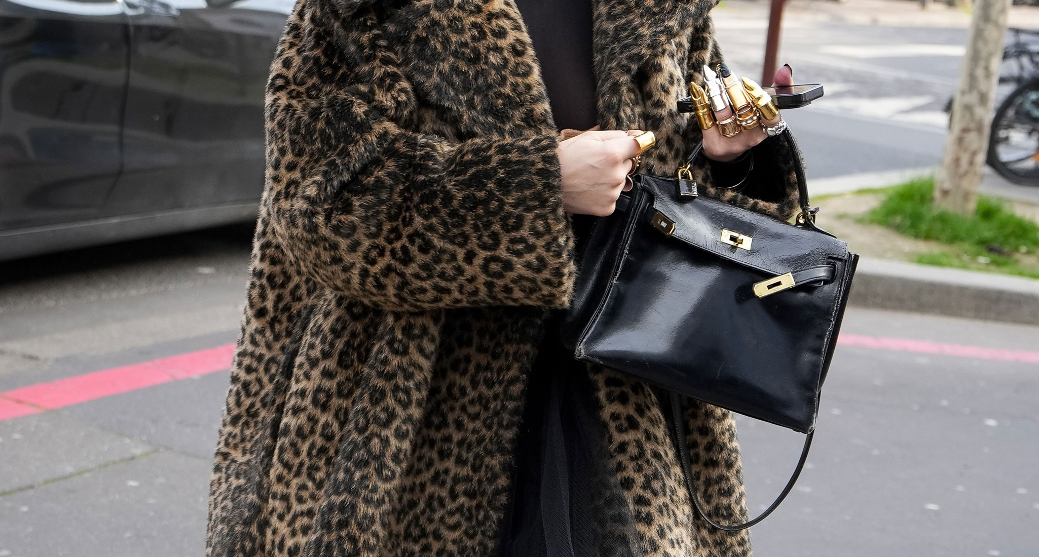 Undone Belted Bags: Undone black belted bag with leopard coat
