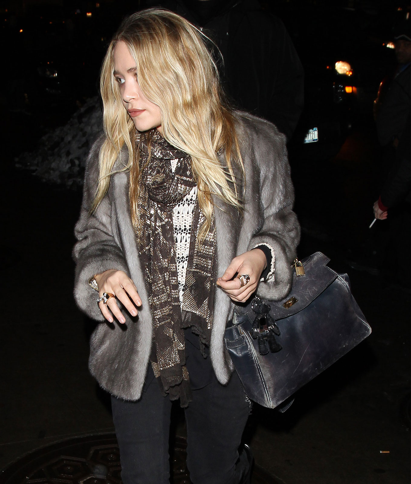 Undone Belted Bags: Mary-Kate Olsen carrying undone Hermes Kelly bag in fur coat
