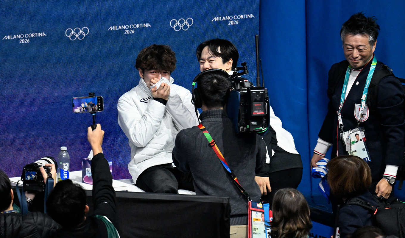 Yuma Kagiyama cries before the medal ceremony for the men's figure skating event