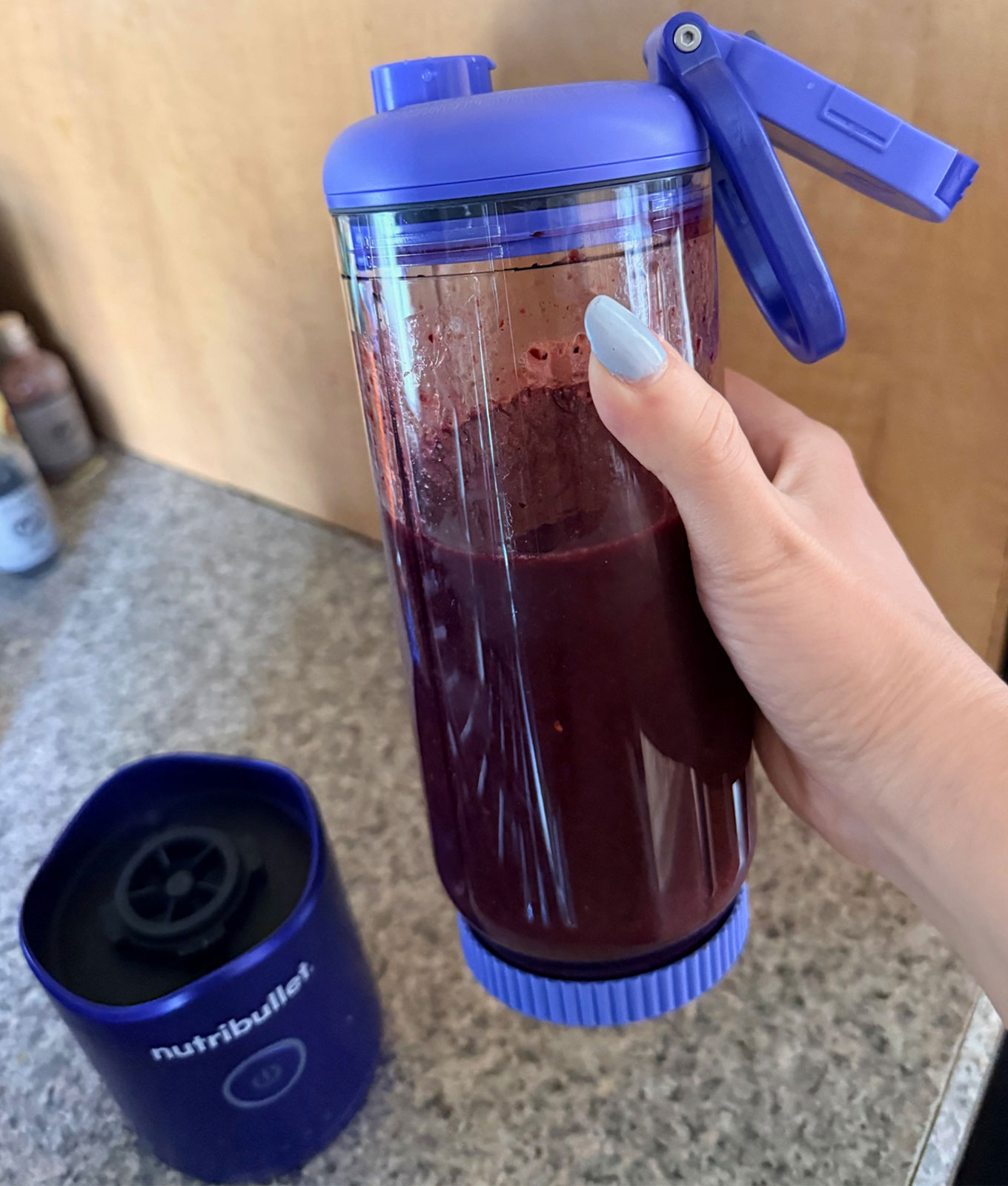 NutriBullet Flex Portable Blender Review: Original photo by Stephanie Maida holding blender with smoothie