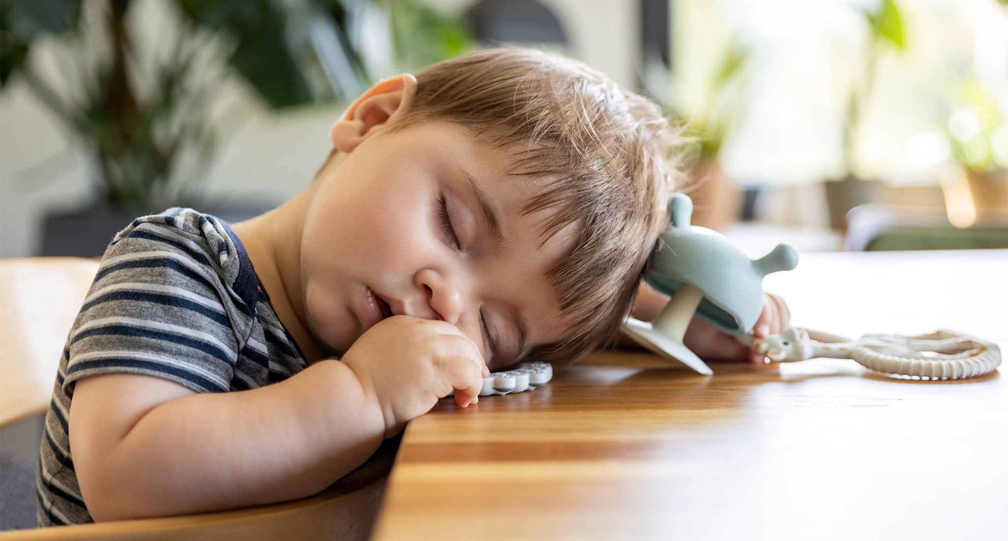 parents-feeding-babies-butter-trend: a baby sleeping