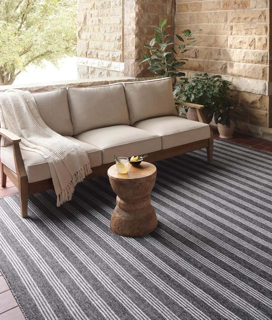 loloi striped rug with sofa on it