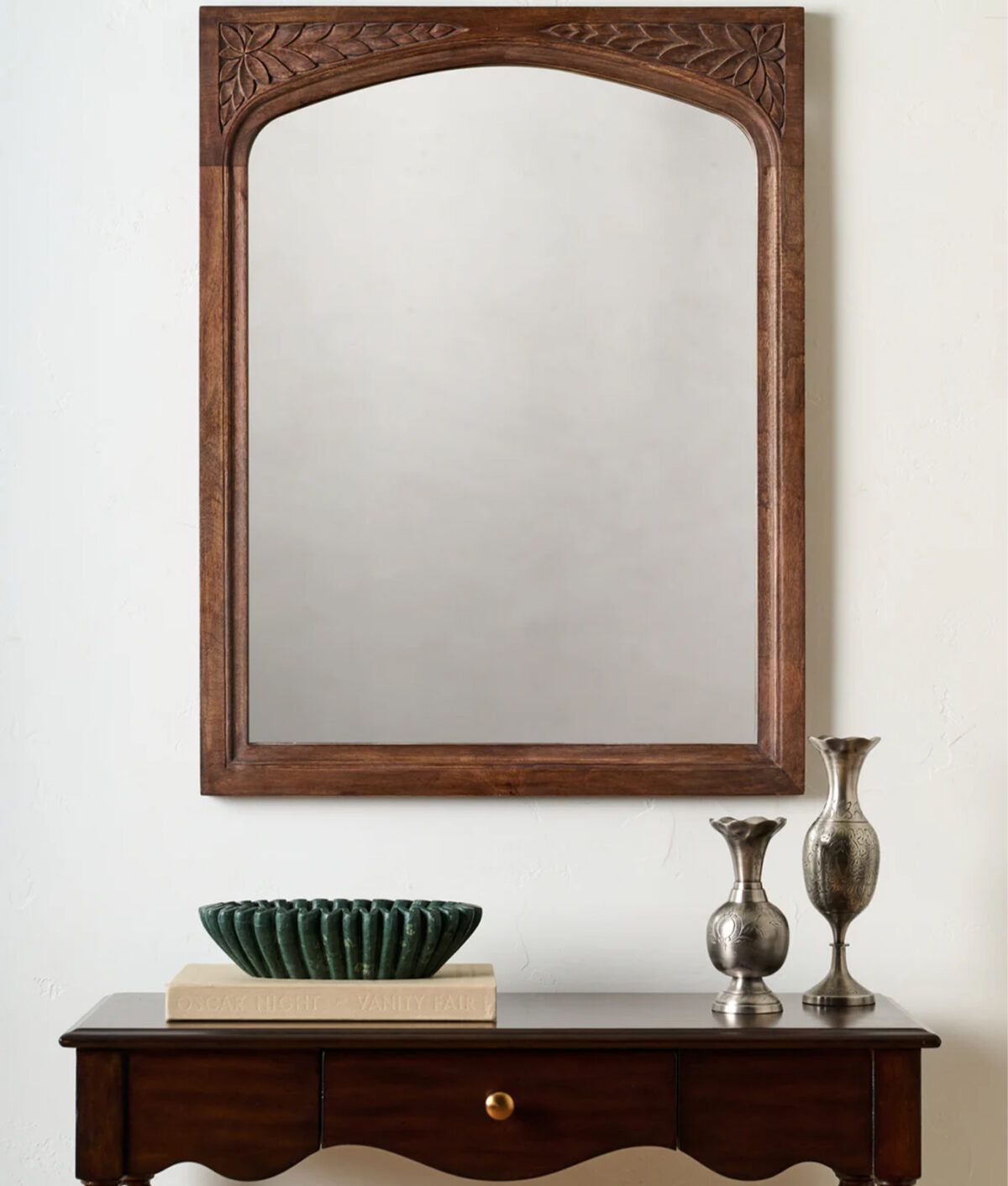 The Magnolia Foster Carved Wood Mirror.
