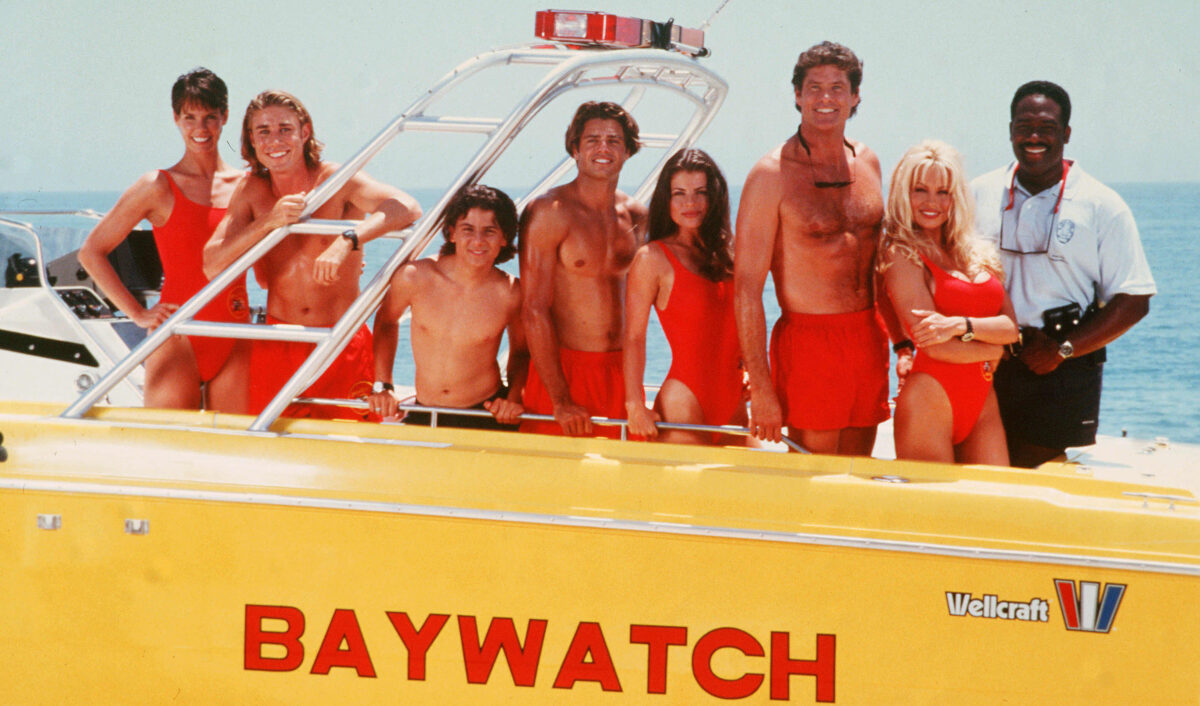 pamela anderson on the set of baywatch on a boat with cast in 90s