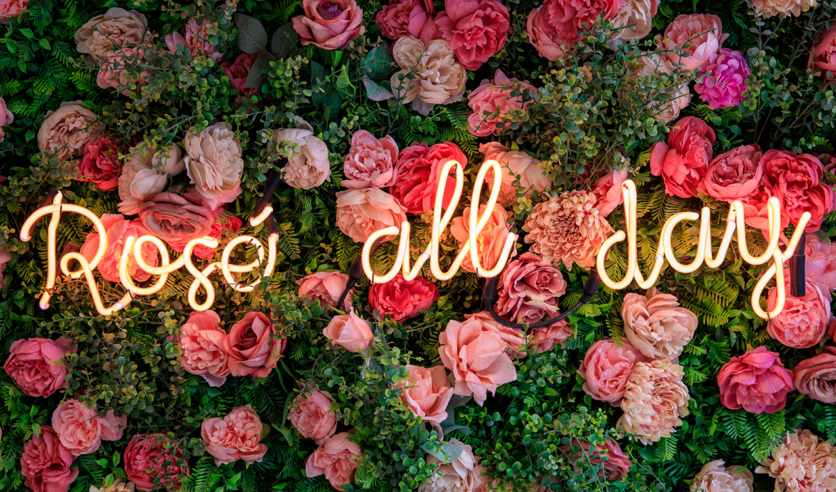 wine neon sign among floral wall