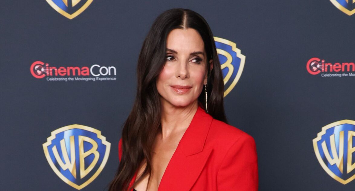 Sandra Bullock Rocks Bold Animal Print Dress with Thigh-High Slit (and Reveals Her Alter Ego's Name)