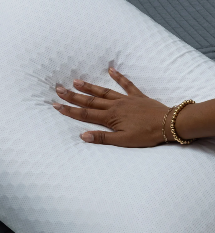 purple pillow squished by hand