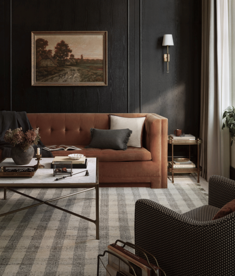 leather sofa and checkered rug in living room