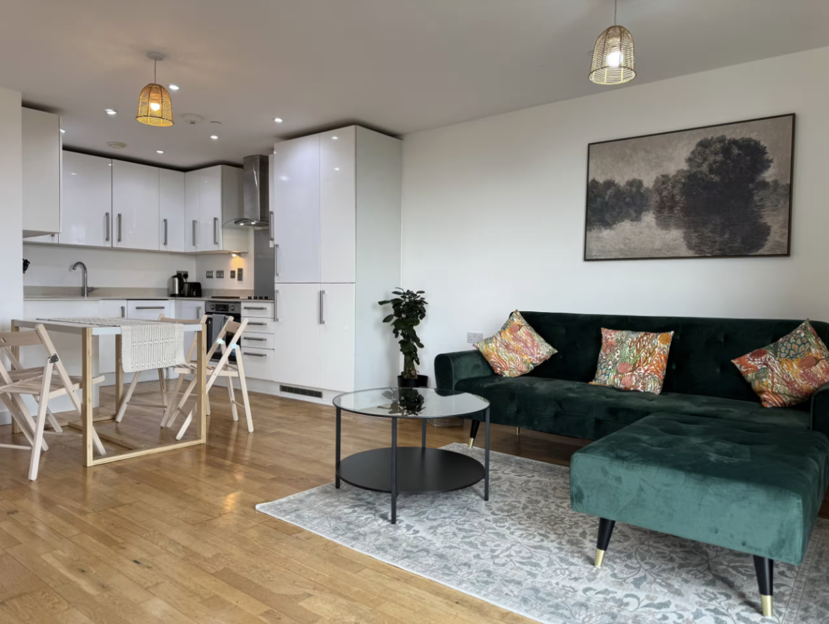 teal chair and modern furnishings in apartment living room