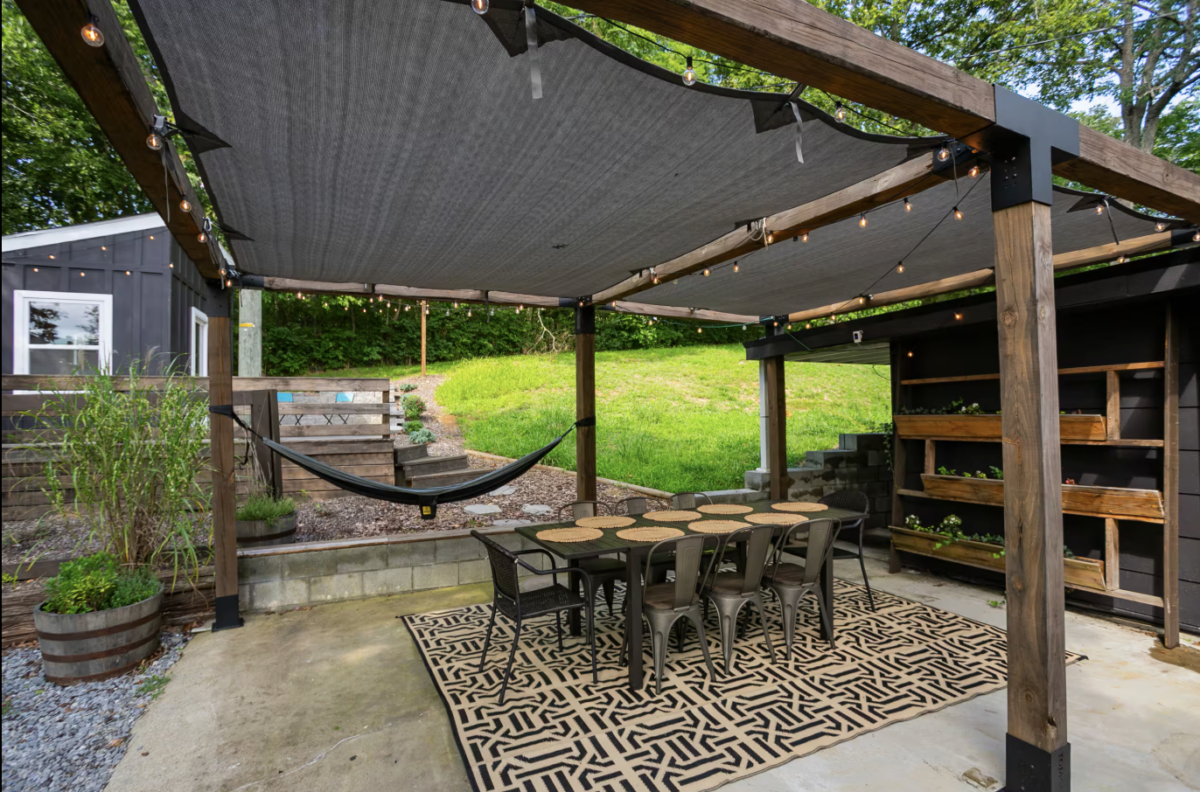 outdoor dining area with tent on top