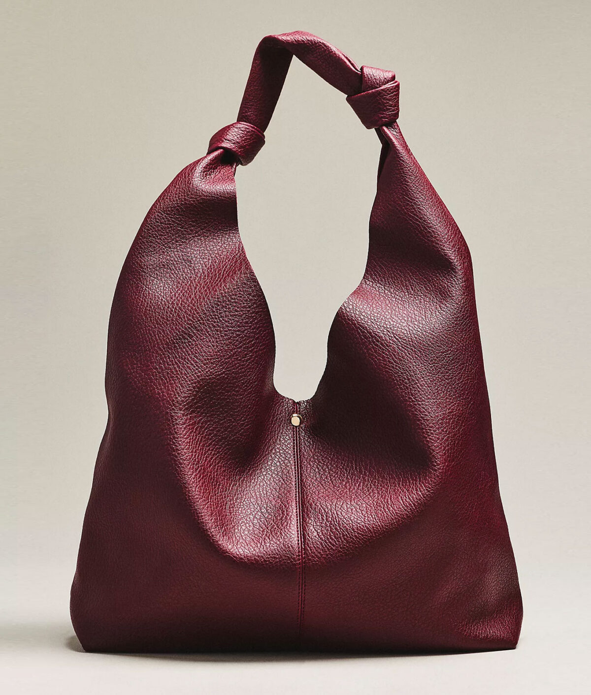 plus size editor fall shopping list anthopologie love knot slouchy bag 1200x1412